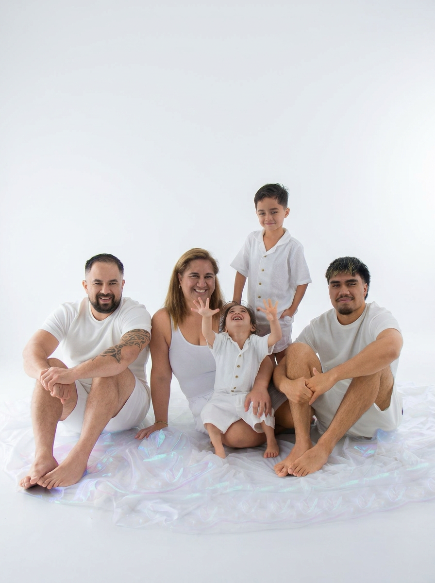 Family of five in white wardrobe on bright clean studio backdrop