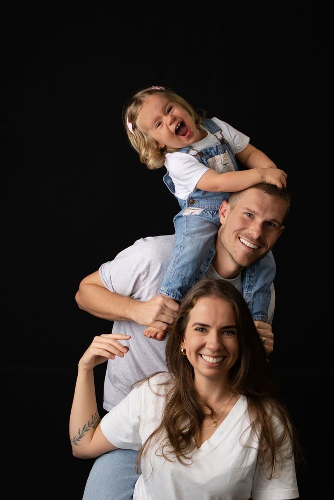 Family laughing together during a studio session