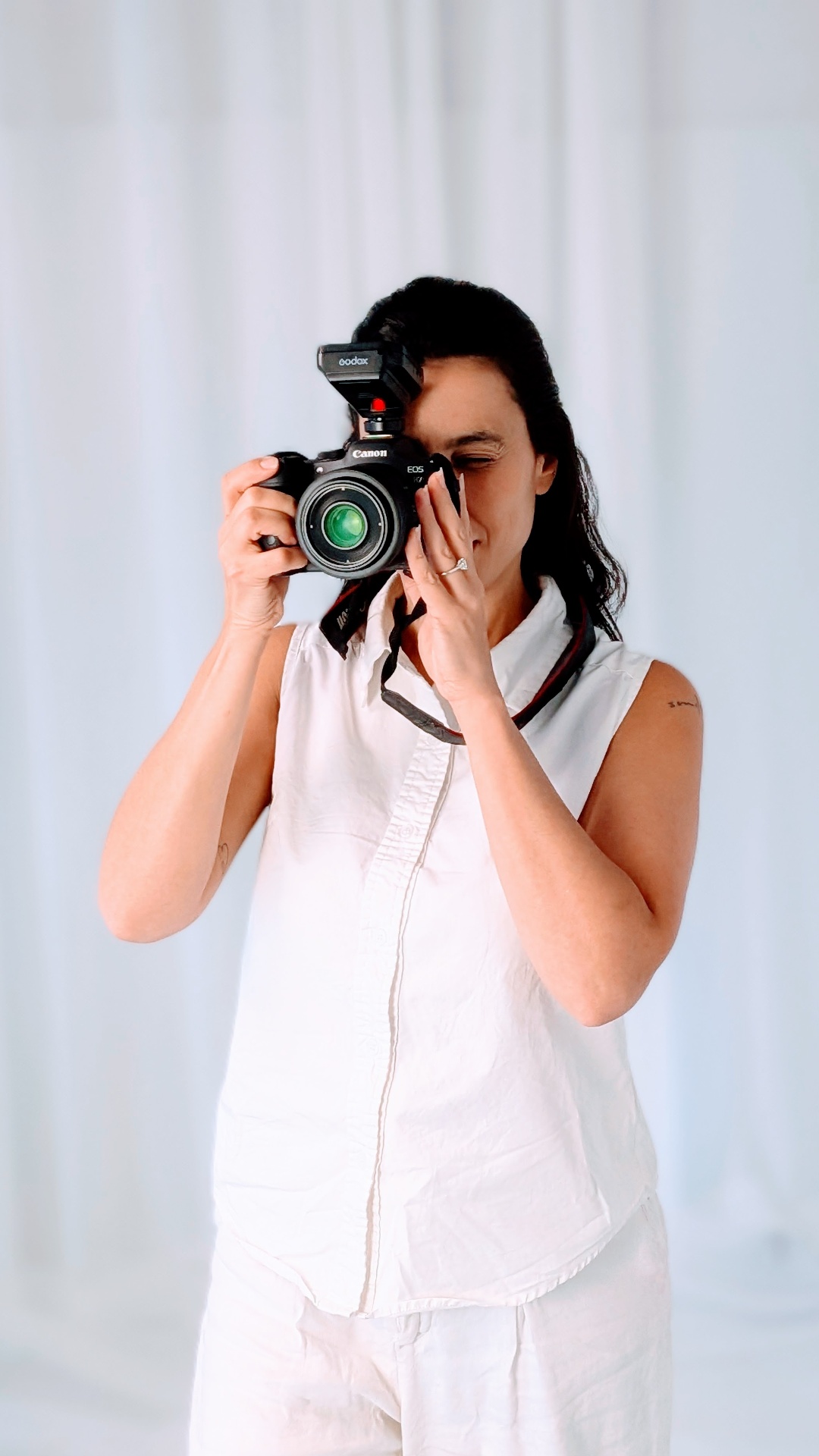 Aline filming in the Mona Vale studio — a cinema-trained eye behind every frame.